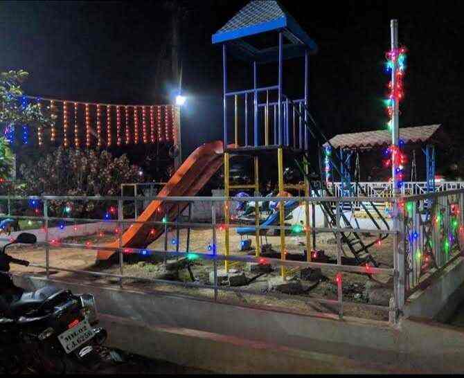 Children's play area with slides and fairy lights at Wagheshwar Dhaba